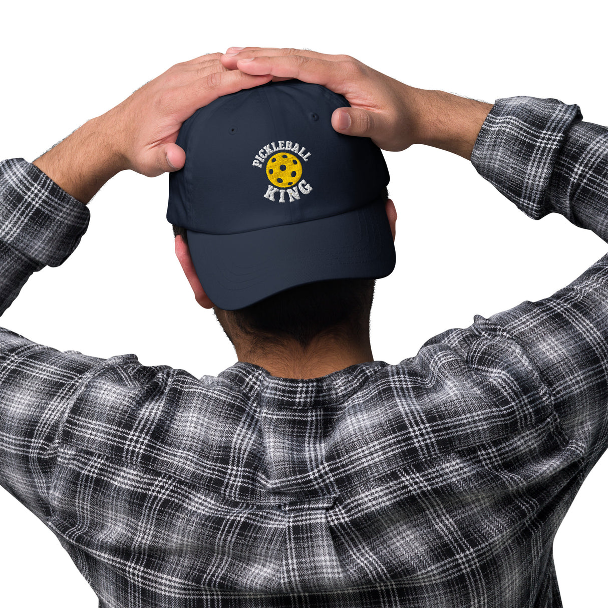 Navy dad hat embroidered with Pickleball King design, worn by man in plaid shirt