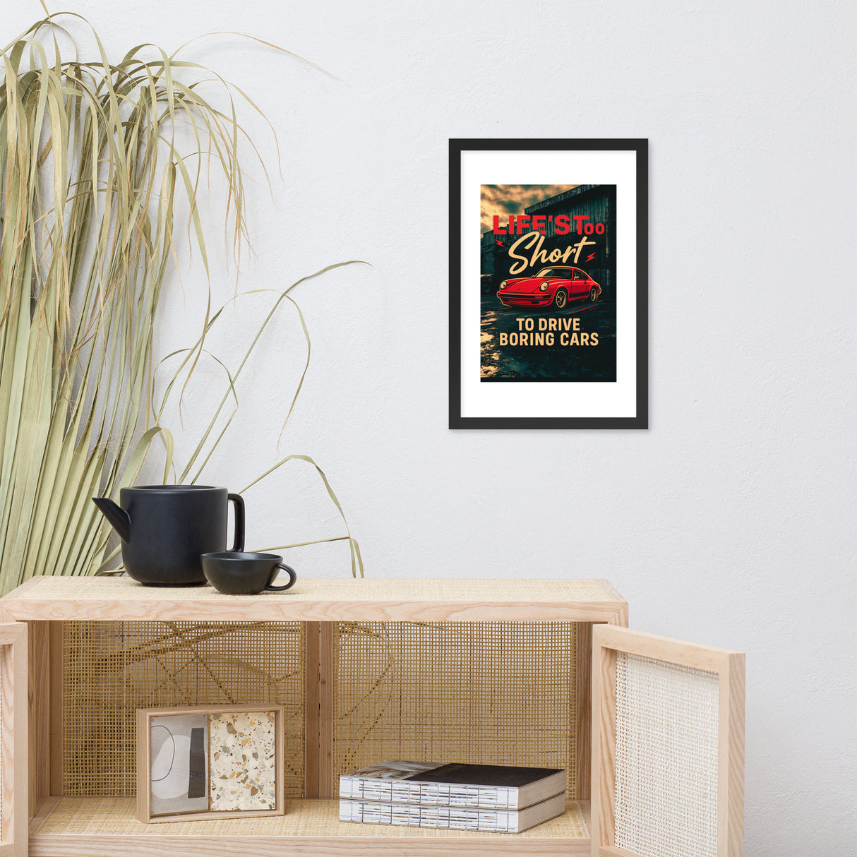 Framed poster with motivational quote on a wall above a wooden shelf.