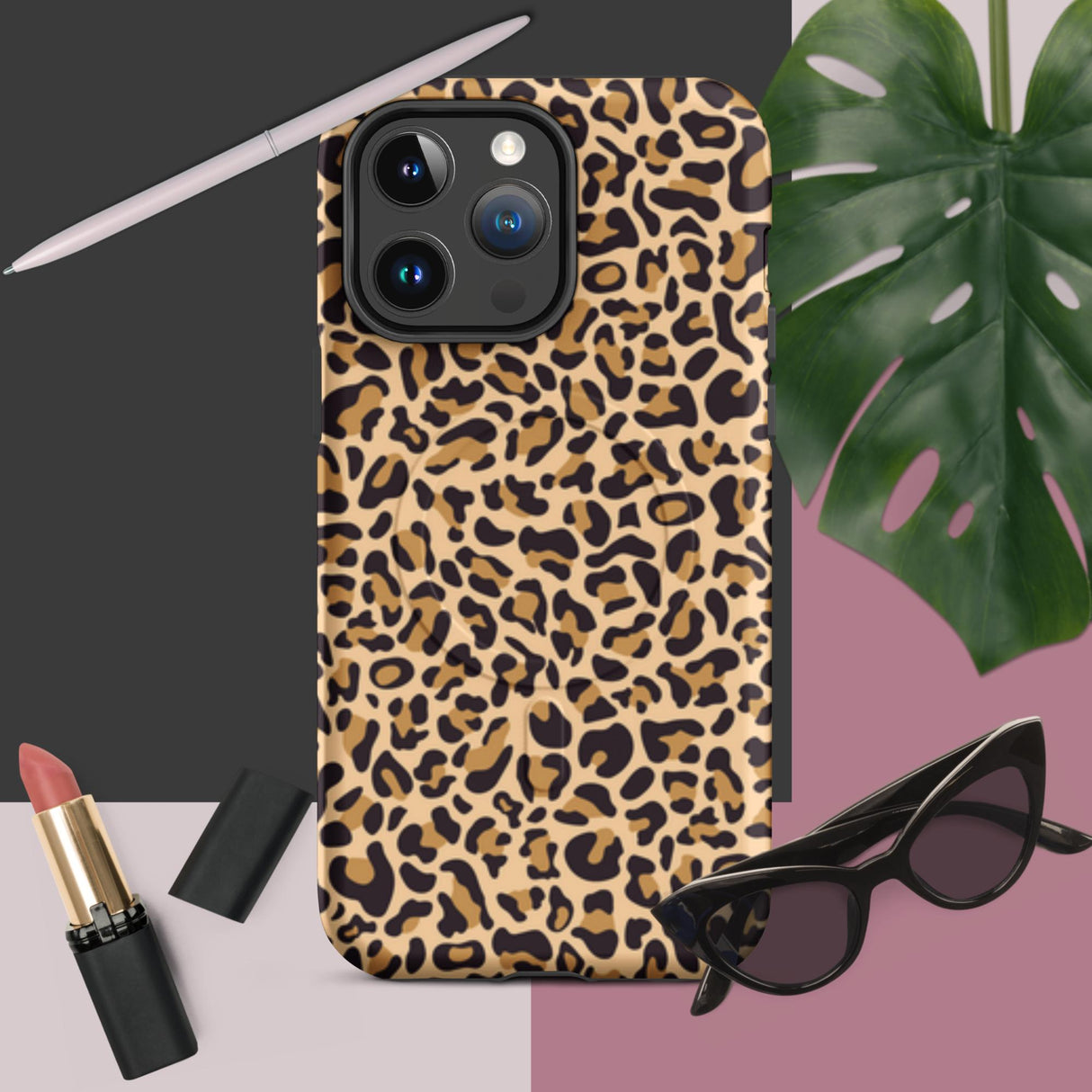 Leopard print phone case with lipstick and sunglasses on a gradient background
