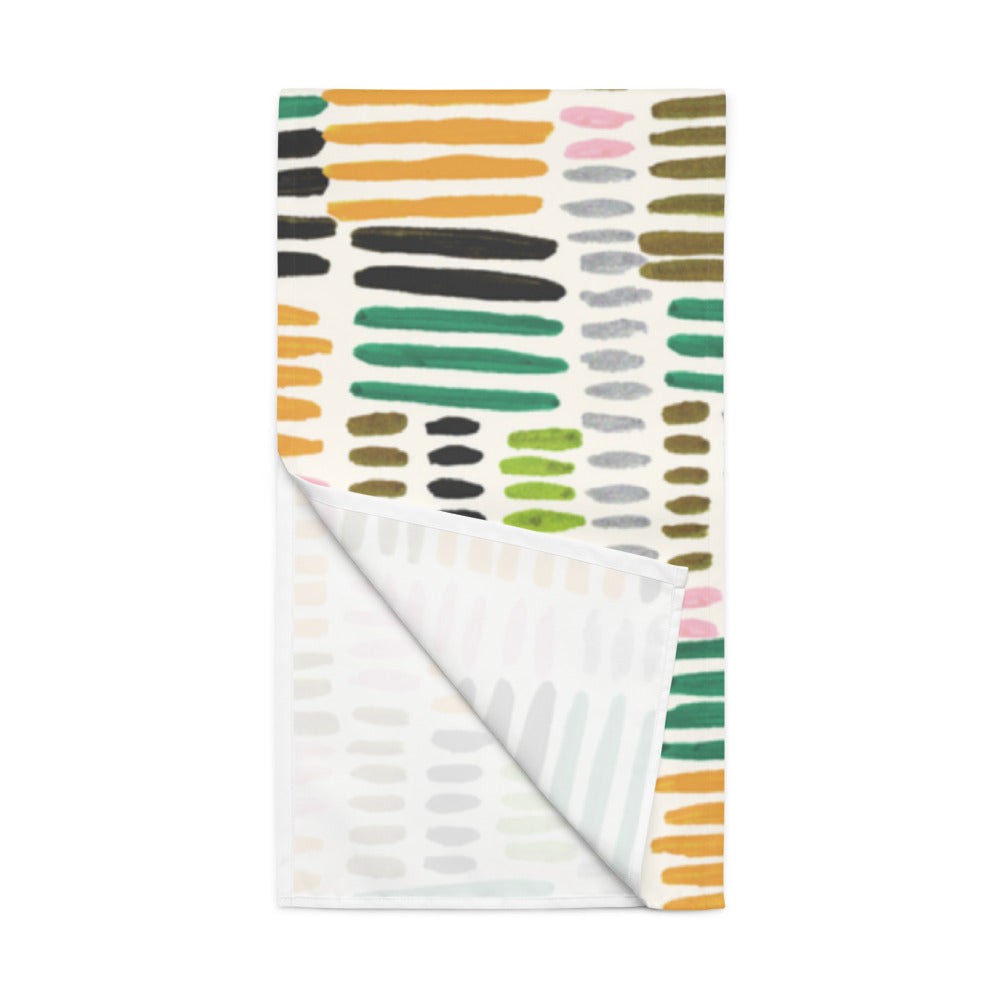 Colorful patterned paper with abstract designs on a white background