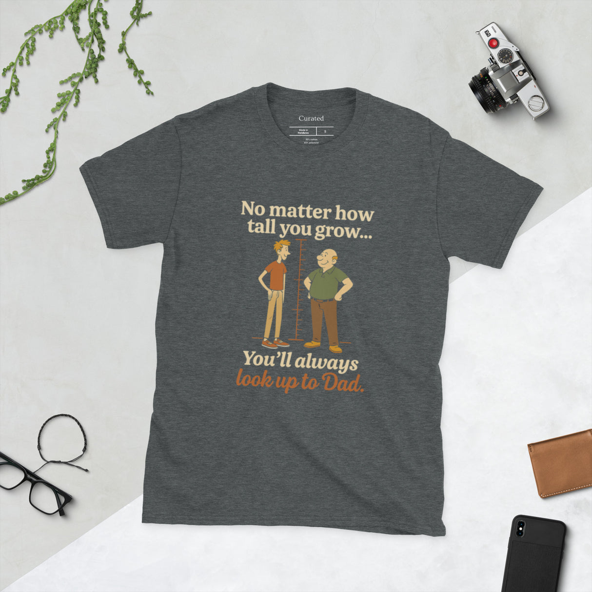 Graphic t-shirt with humorous Father’s Day design showing a son looking up to his dad with the phrase “You’ll always look up to Dad.”