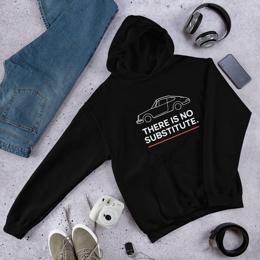Black Porsche 911 hoodie with “There Is No Substitute” slogan – flat lay with jeans and headphones