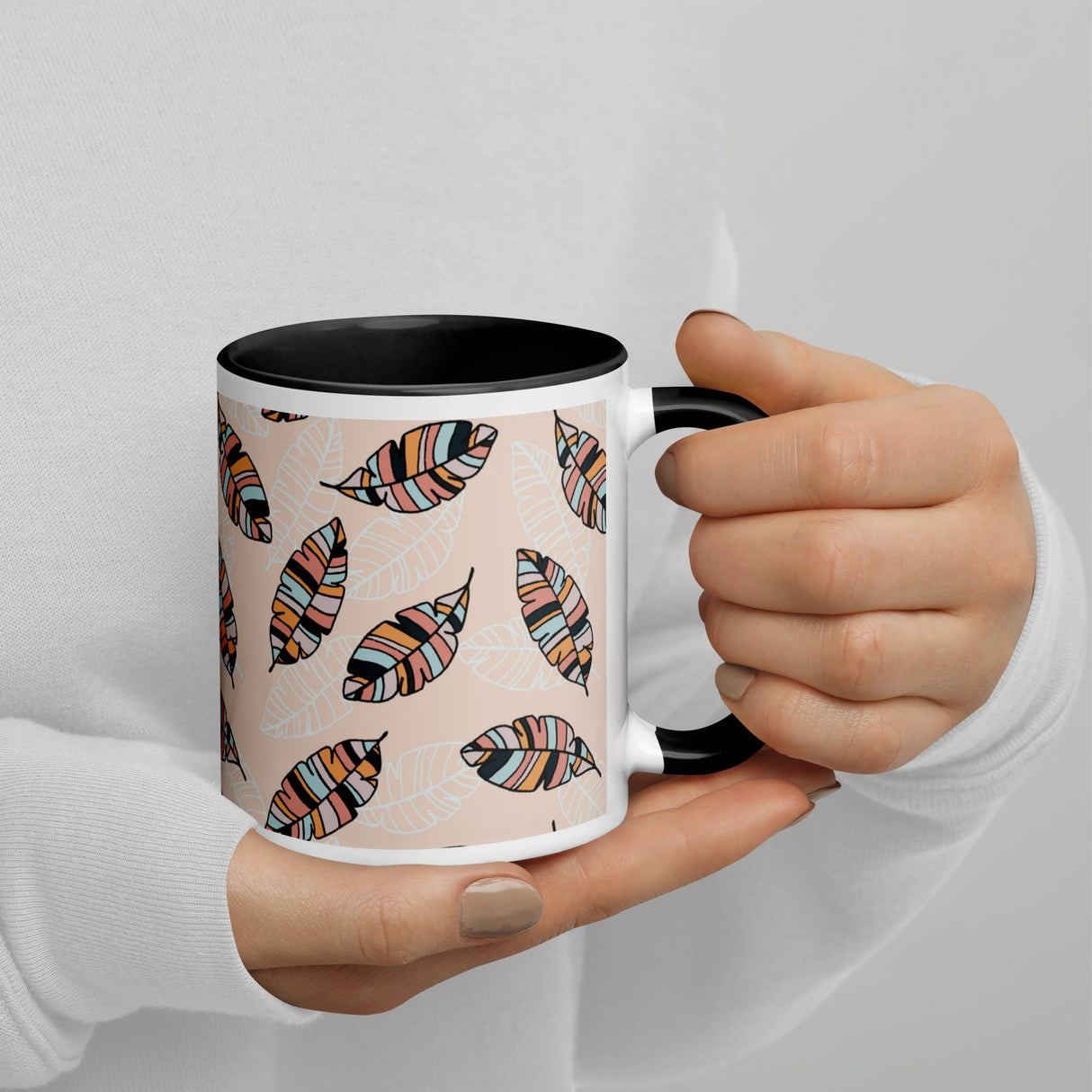 Boho feathers ceramic mug with black rim, handle, and interior