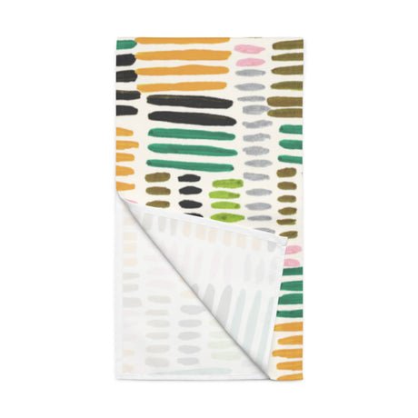 Colorful patterned paper with abstract designs on a white background