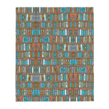 Throw blanket with coloured books on a bookshelf