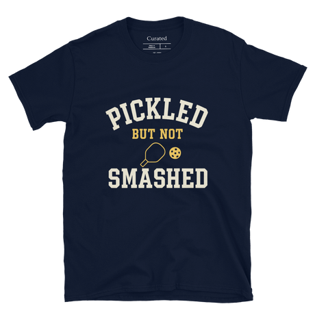 Navy blue t-shirt with 'Pickled But Not Smashed' text and pickleball graphics on a white background.